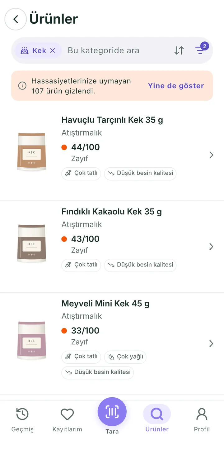 Kek kategorisinde arama: “Hassasiyetlerinize uymayan 107 ürün gizlendi” uyarısı ve puanlarıyla kek ürünleri.